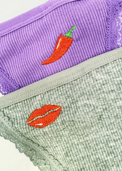 A close up image of Berry Sorbet’s Hazy Lips and Grape Mist Chilli tibbed thongs next to each other.