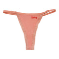 A flat image of Berry Sorbet’s Peach Melt “Spicy” ribbed cotton thong with red embroidery.