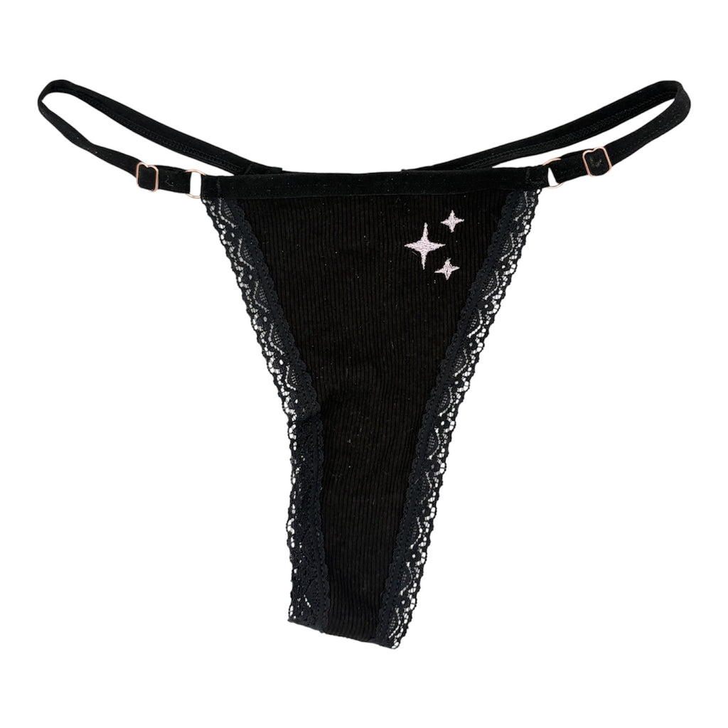 A flat image of Berry Sorbet’s Black Berry Sparkles ribbed cotton thong with pink sparkles embroidery.